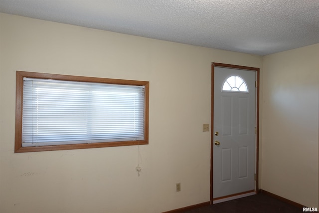 entrance foyer with a textured ceiling