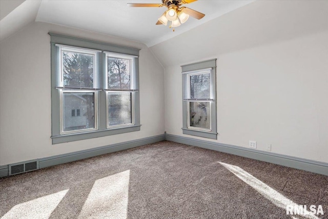 additional living space with carpet flooring, vaulted ceiling, and ceiling fan