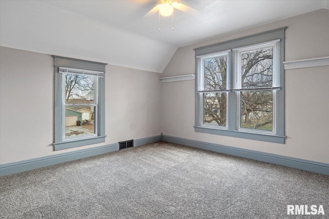 additional living space featuring carpet flooring, ceiling fan, and lofted ceiling