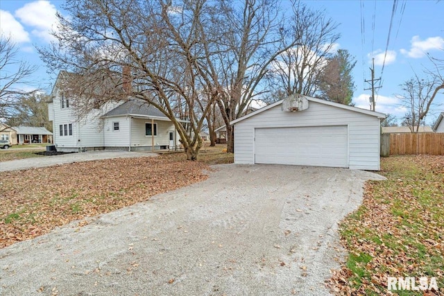 exterior space featuring a garage and an outdoor structure