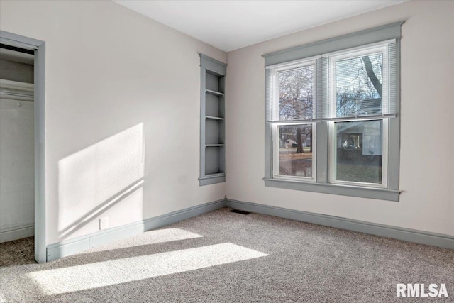 interior space with carpet floors and a closet