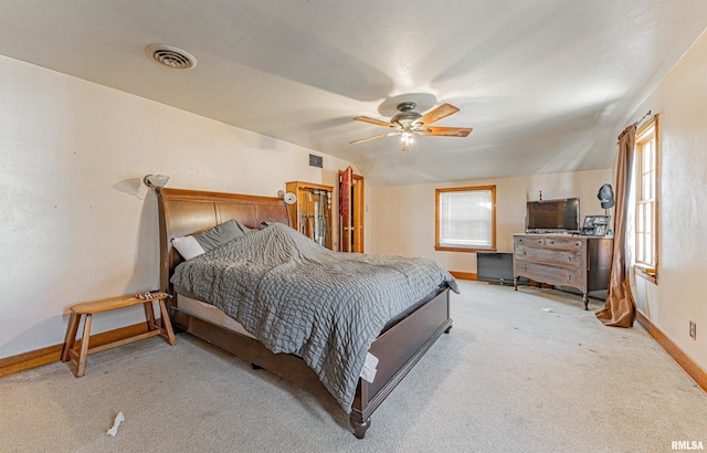 carpeted bedroom with ceiling fan