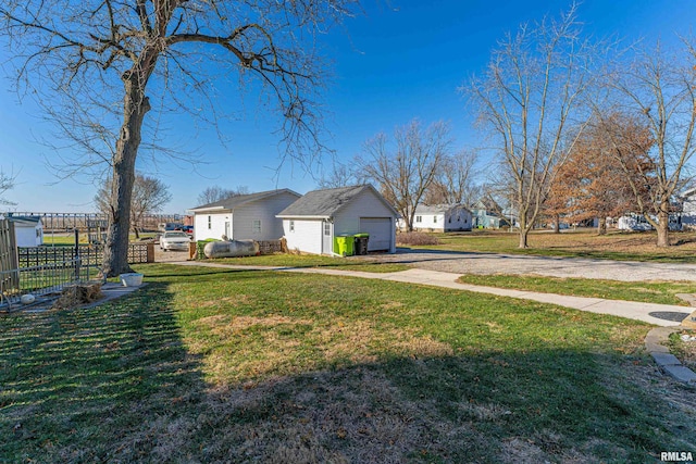 view of side of home with a lawn and a garage