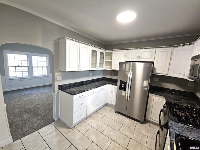 kitchen featuring crown molding, white cabinetry, light carpet, and appliances with stainless steel finishes