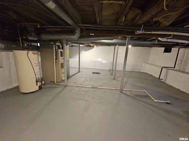 basement featuring gas water heater and heating unit