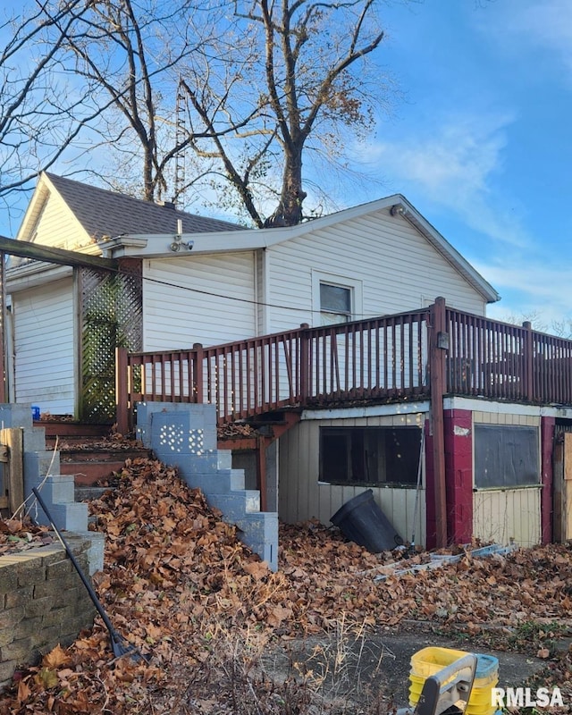 back of house featuring a wooden deck