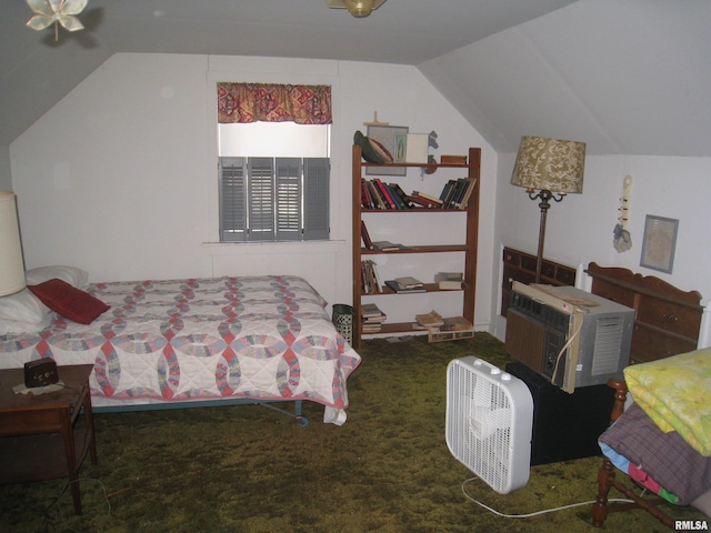 bedroom with carpet flooring, a wall unit AC, and vaulted ceiling