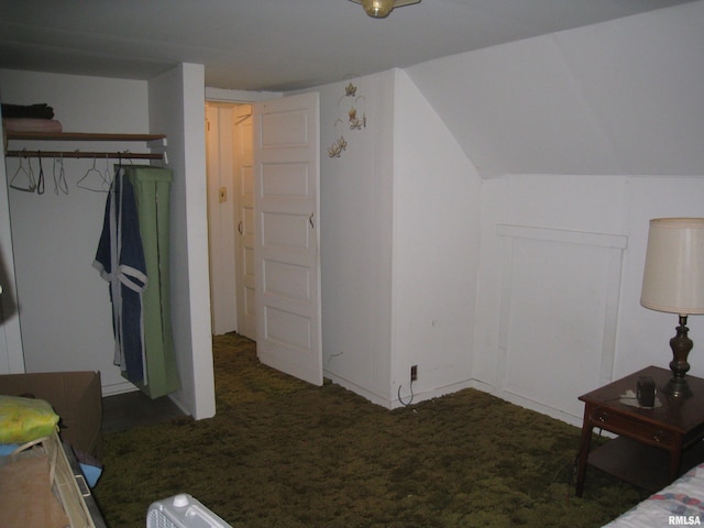 bedroom with dark colored carpet