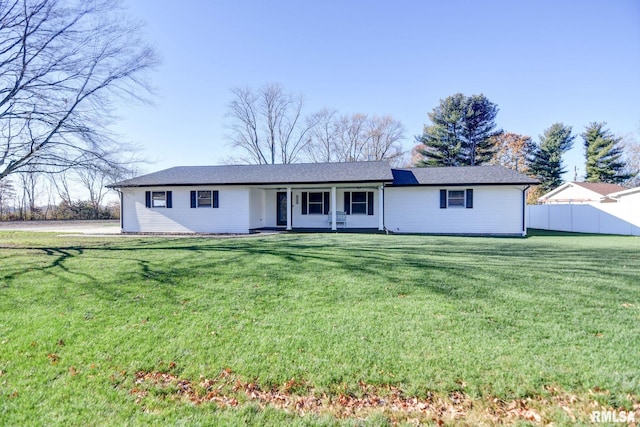 ranch-style house featuring a front lawn