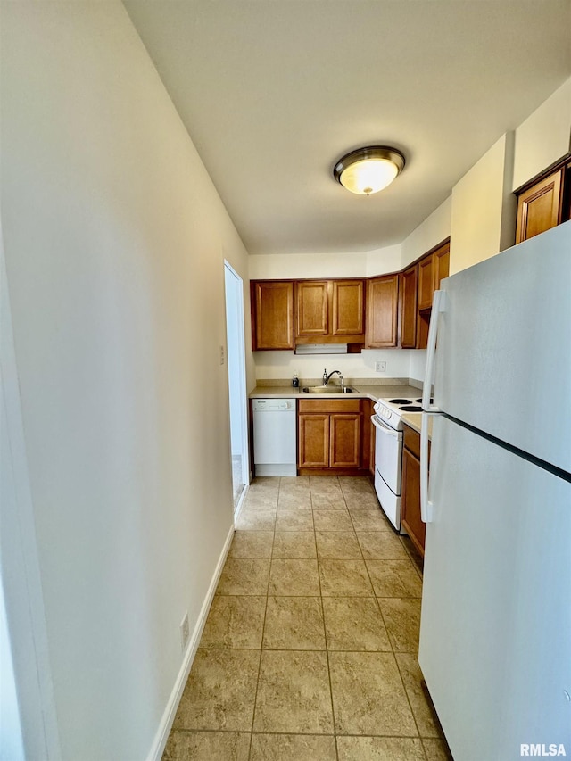 kitchen featuring sink and white appliances