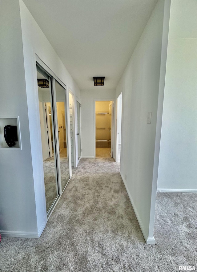 hallway with light carpet