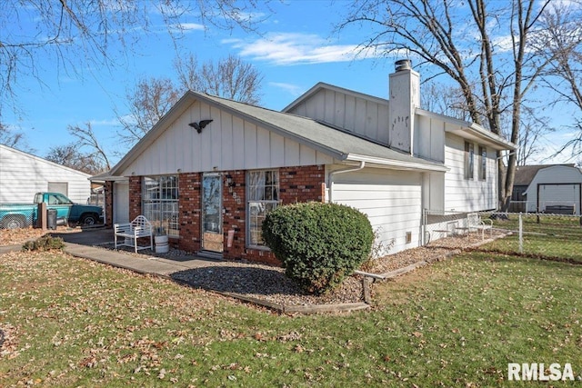 back of house with a yard and a patio area