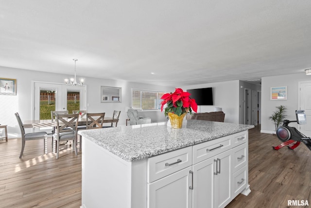 kitchen featuring white cabinets, plenty of natural light, and dark wood-type flooring