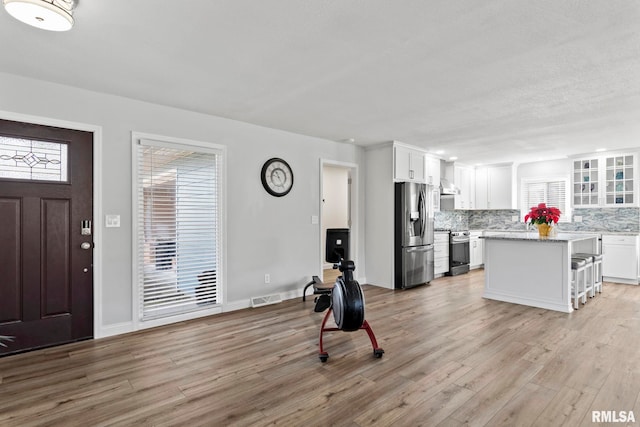 foyer entrance featuring light hardwood / wood-style floors