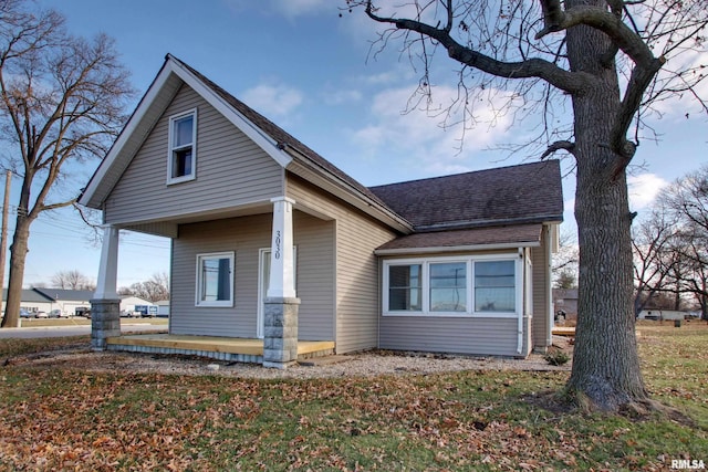 view of side of property with a porch