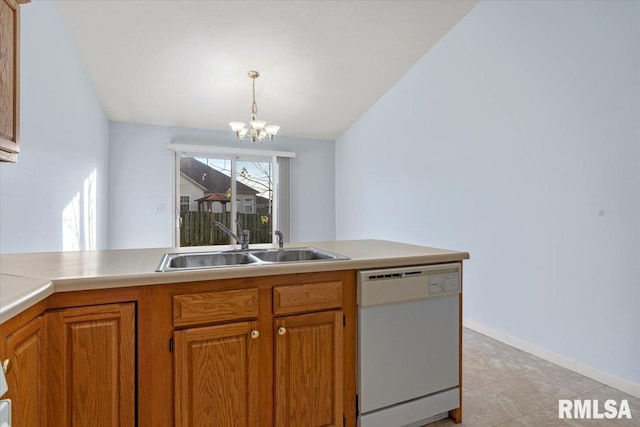 kitchen featuring pendant lighting, dishwasher, sink, and an inviting chandelier