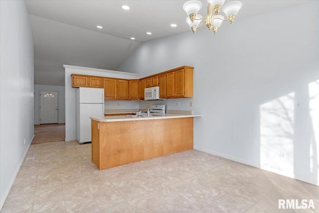 kitchen with kitchen peninsula, white appliances, decorative light fixtures, high vaulted ceiling, and a notable chandelier