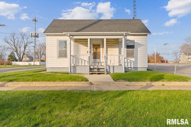 bungalow-style home featuring a porch and a front lawn