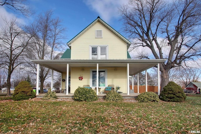 view of front facade with covered porch and a front yard