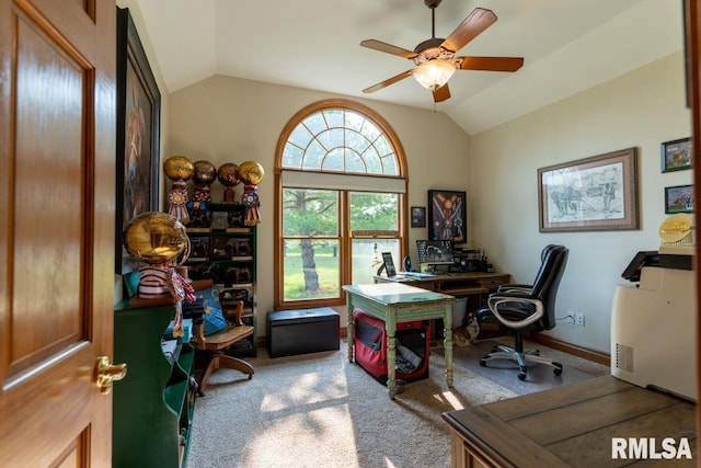 carpeted office space with ceiling fan and lofted ceiling