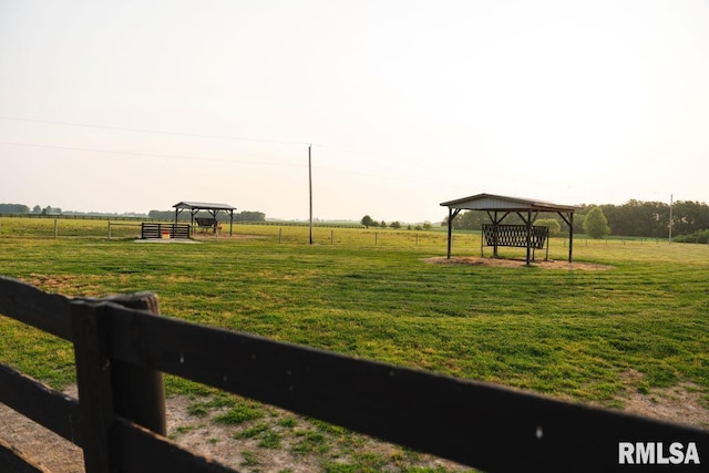 view of community with a gazebo, a yard, and a rural view