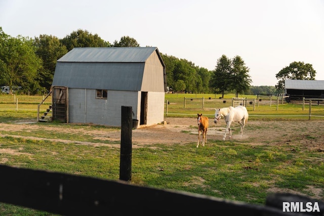 view of outdoor structure with a rural view