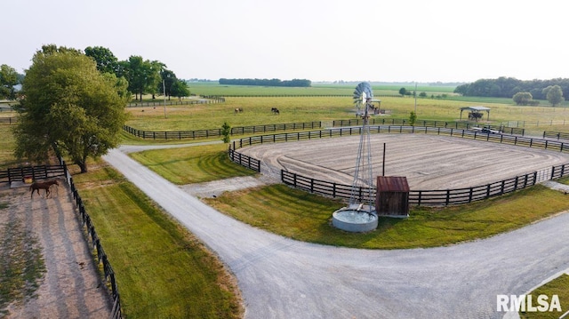 birds eye view of property with a rural view