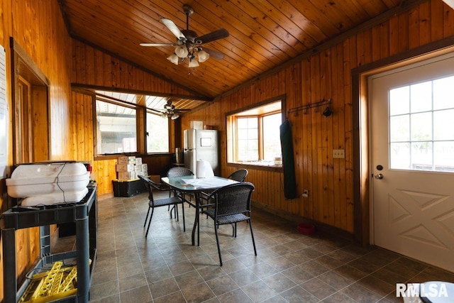 dining area with plenty of natural light and wood ceiling