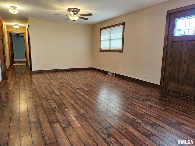 foyer with dark hardwood / wood-style flooring and ceiling fan