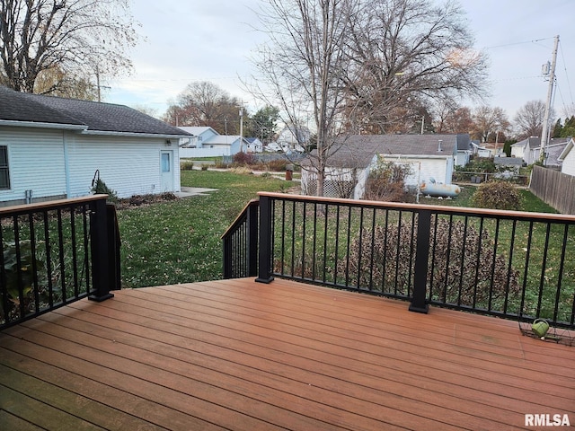 wooden terrace with a yard