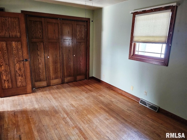 unfurnished bedroom featuring light hardwood / wood-style floors