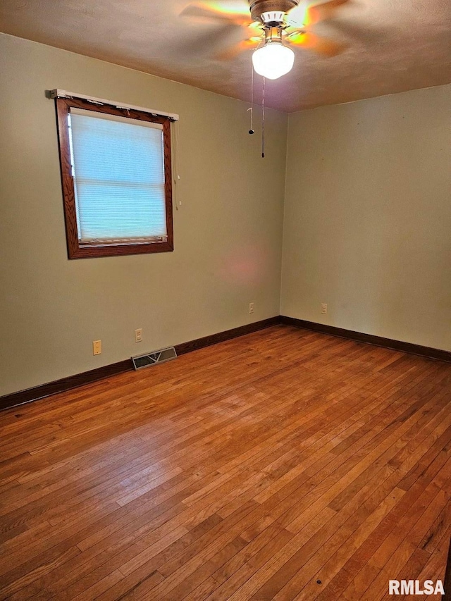 unfurnished room featuring ceiling fan and light hardwood / wood-style flooring