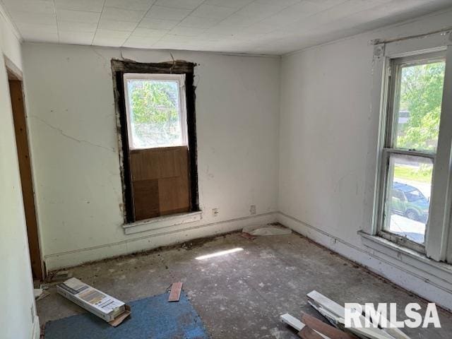 unfurnished room featuring a wealth of natural light