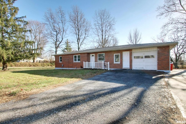 ranch-style home with a garage and a front yard