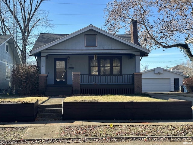 view of front of home with an outbuilding, a garage, and covered porch