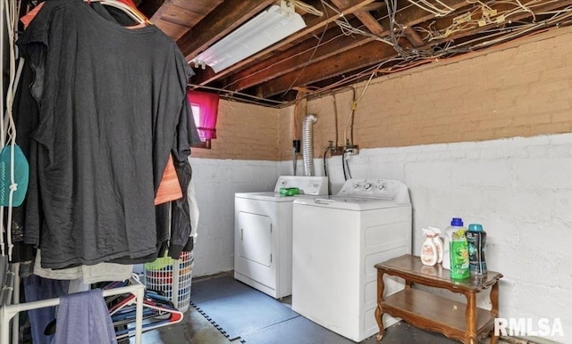 laundry area with washing machine and dryer