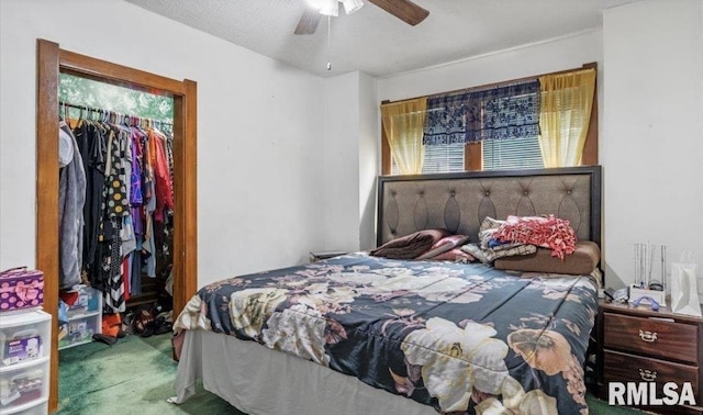 bedroom featuring carpet flooring, ceiling fan, a closet, and a textured ceiling