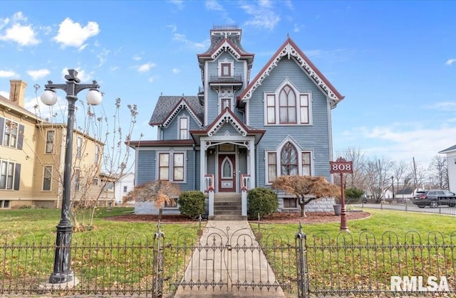 view of front of home with a front yard