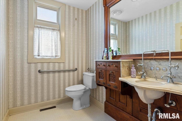 bathroom featuring tile patterned flooring and toilet