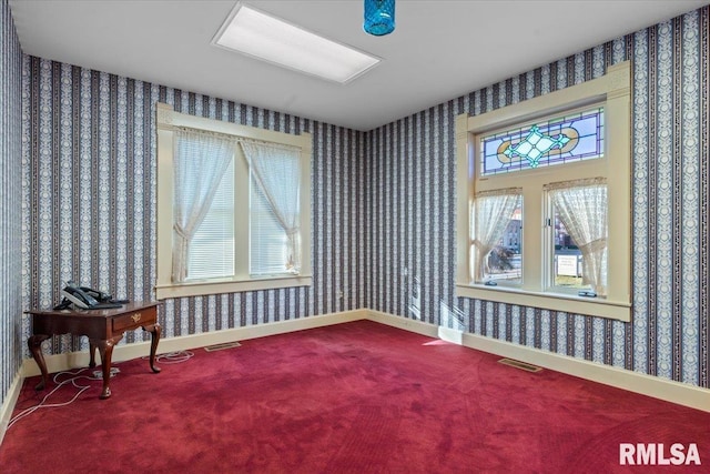 unfurnished room featuring carpet