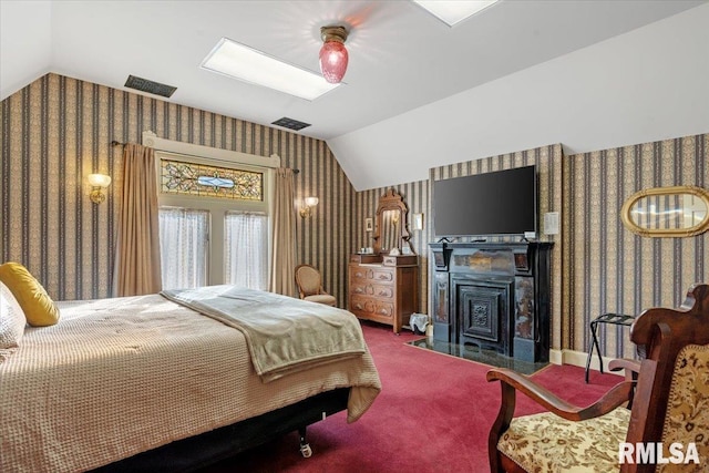 carpeted bedroom with vaulted ceiling