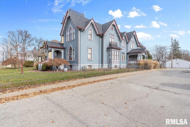 view of property exterior with a lawn