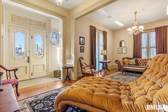 interior space featuring hardwood / wood-style floors and a notable chandelier