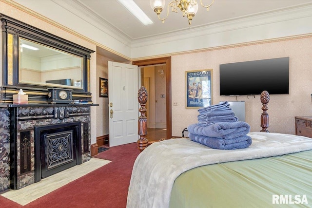 bedroom featuring a fireplace, carpet floors, a chandelier, and crown molding