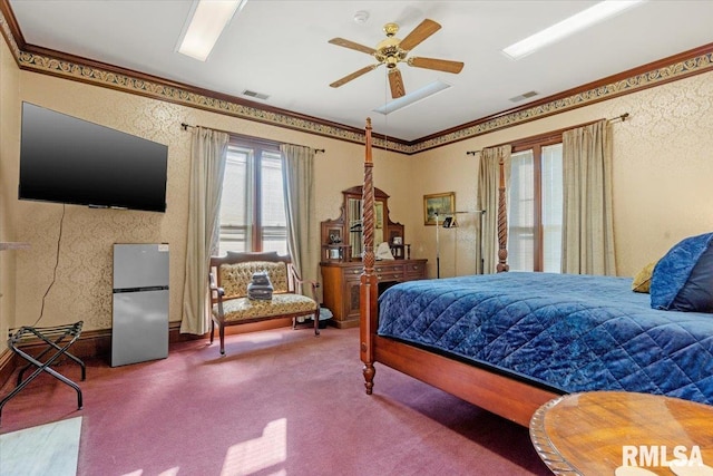 carpeted bedroom with stainless steel fridge, ceiling fan, and crown molding