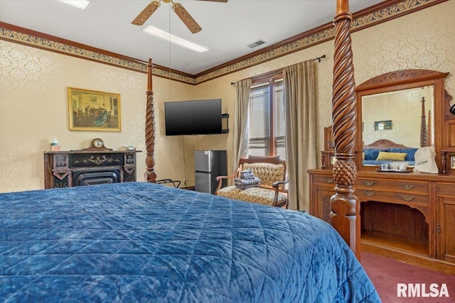 carpeted bedroom featuring stainless steel refrigerator, ceiling fan, and ornamental molding