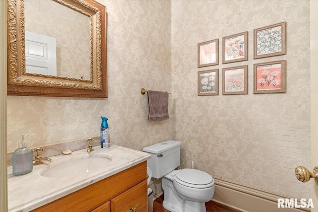 bathroom with vanity and toilet