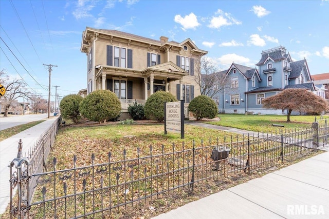 view of front of house featuring a porch and a front lawn