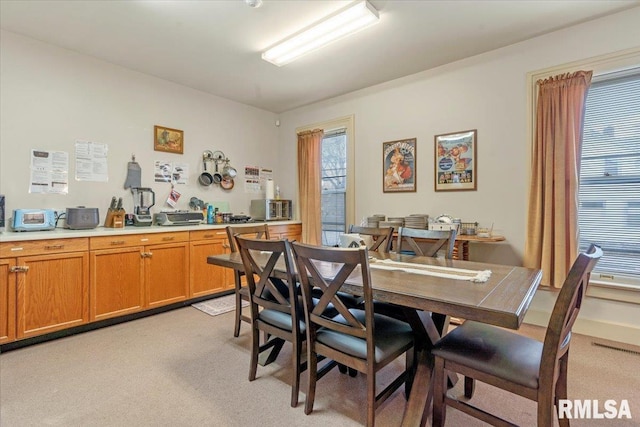 view of carpeted dining area