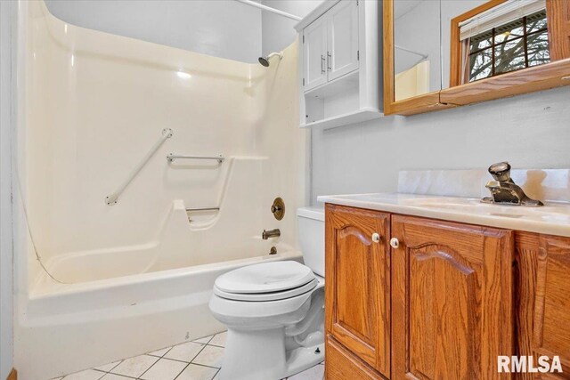 full bathroom featuring shower / tub combination, tile patterned floors, vanity, and toilet